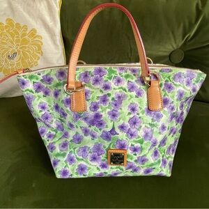 NWOT mint Dooney purple Petunia coated cotton and leather handbag.